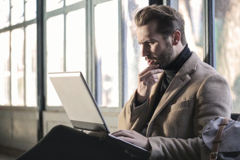 Man typing on laptop